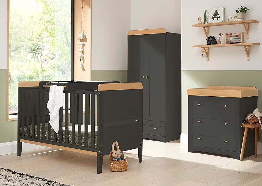 Room view of the Rio 3-piece nursery furniture set in slate and honey oak, showcasing coordinated cot bed, wardrobe and chest changer