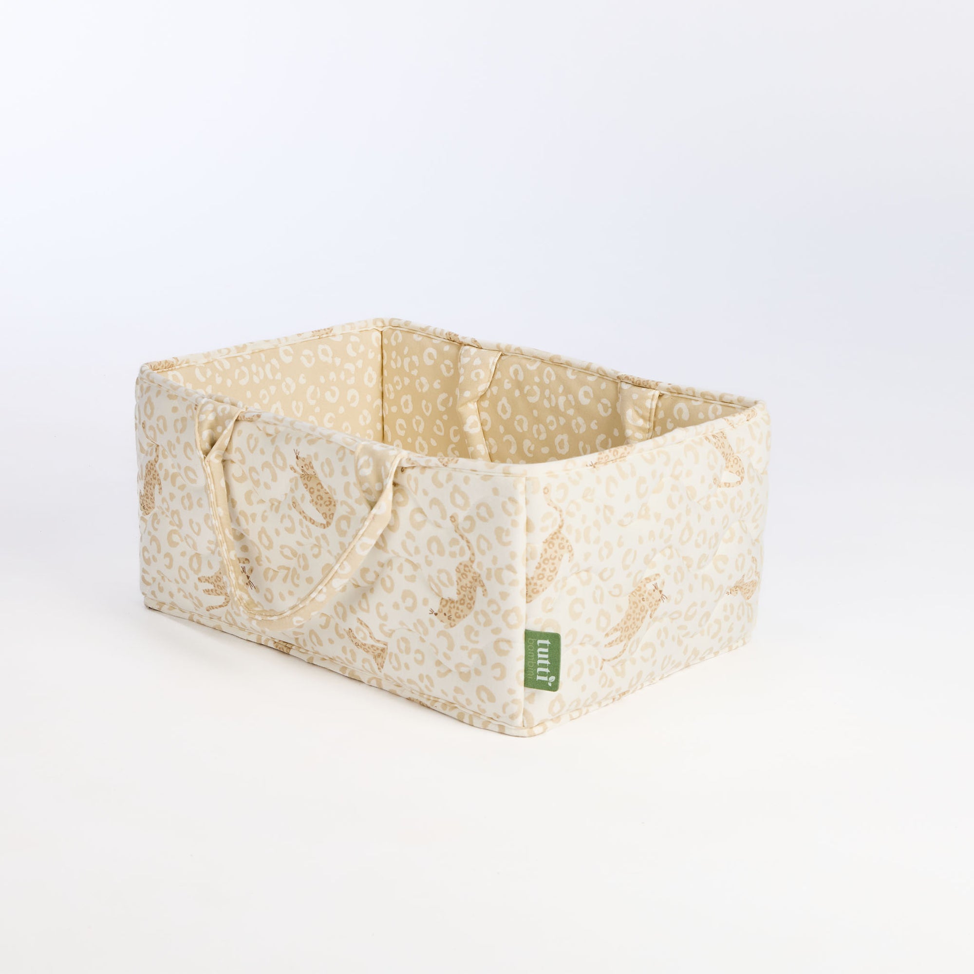 Angled cutout of the Love Cats nappy caddy in beige leopard print, featuring quilted panels, soft lining, and Tutti Bambini brand tag