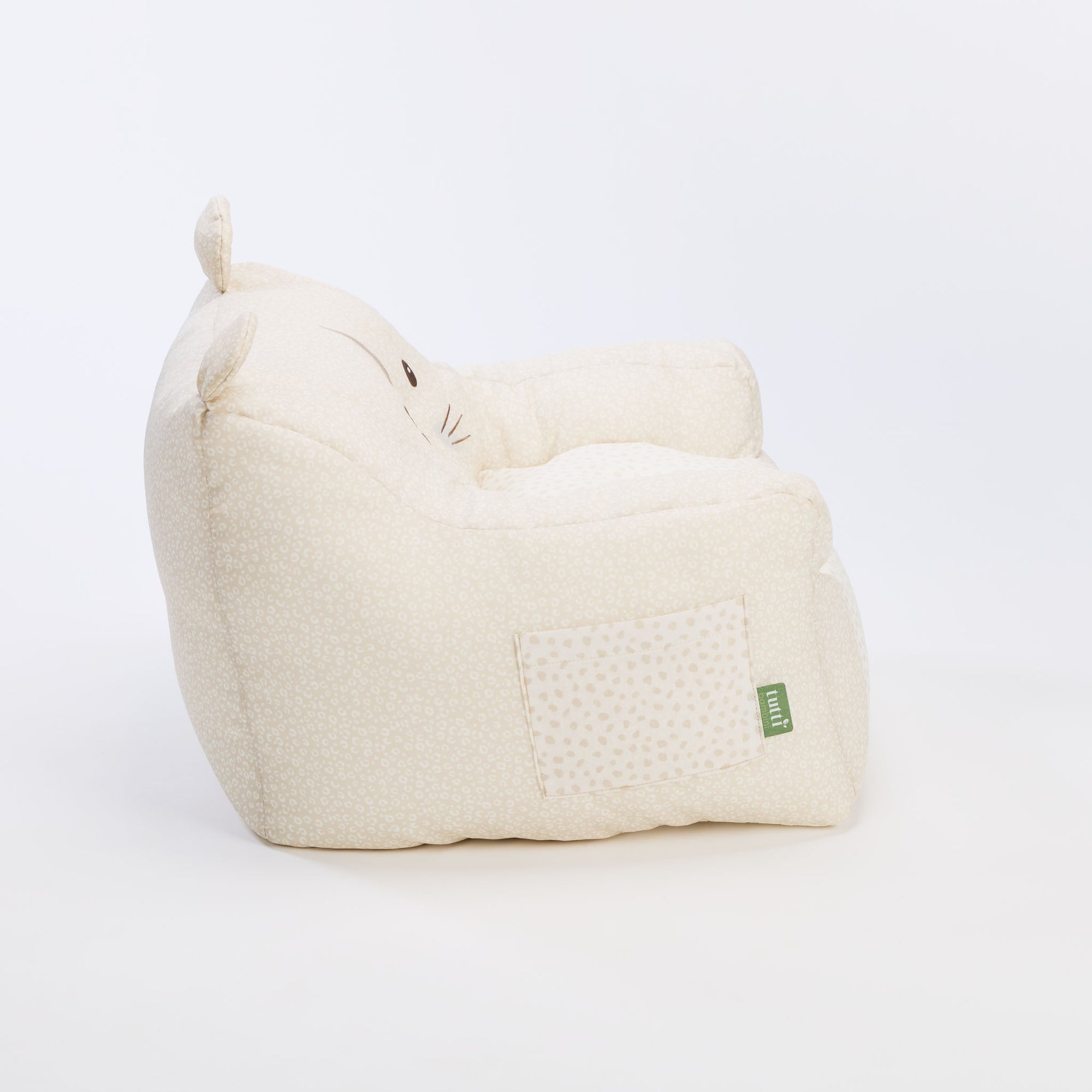 Side view of the Luca Leopard beanbag chair in soft cream fabric with subtle leopard print, showing handy side pocket 