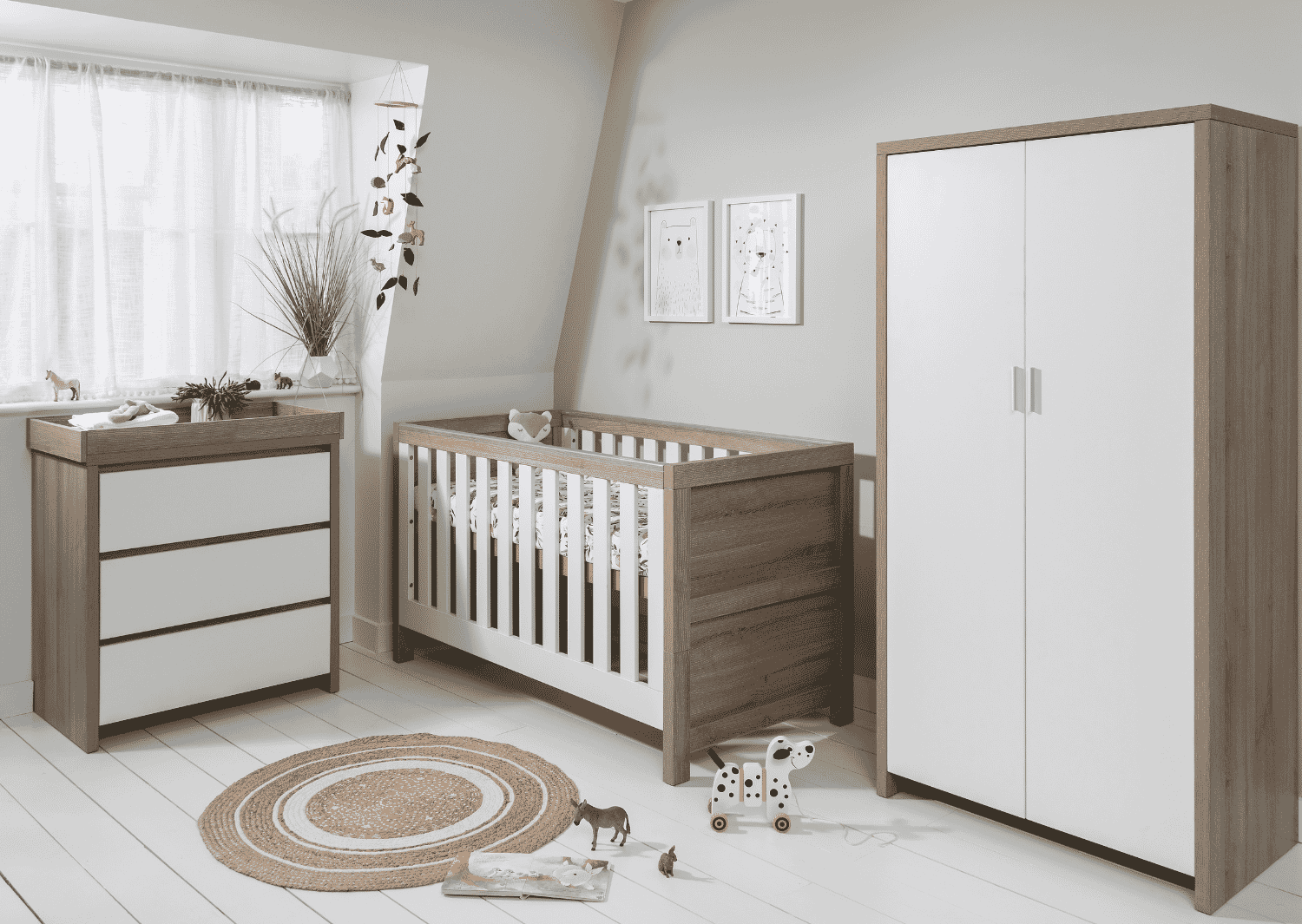 modena 3 piece room set in white oak showing coordinated cot bed wardrobe and chest changer