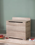 Modena Toy Box Oak styled in a modern nursery room, combining functional toy storage with a clean and natural wood-look aesthetic