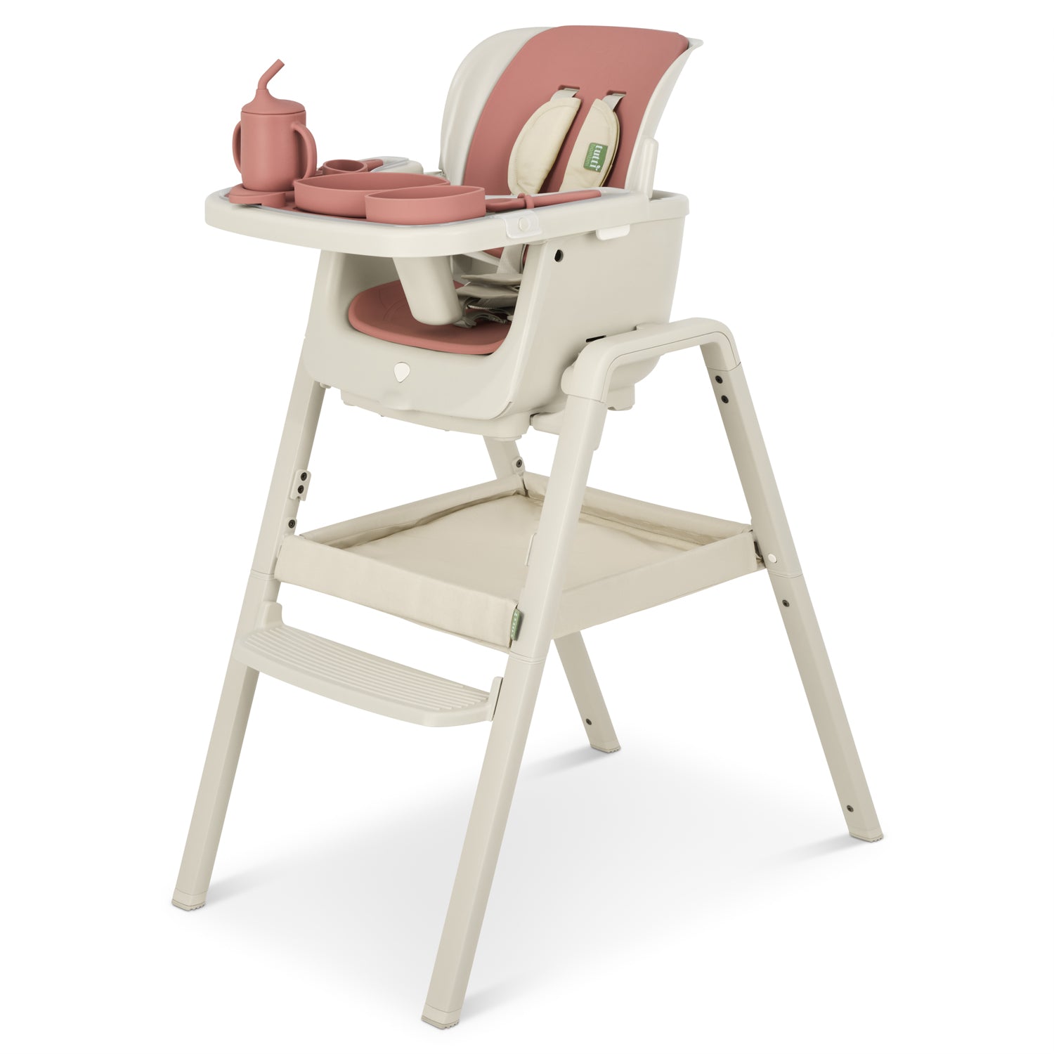 Cutout view of the Nova Maison highchair fitted with the cameo accessory pack, featuring coordinated silicone feeding set and cushioned harness.