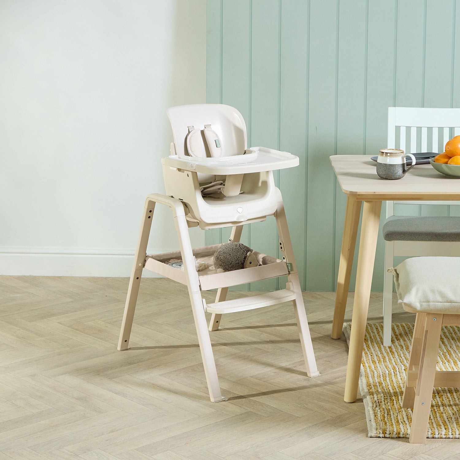 Kitchen view of the nova maison 7 in highchair in parnsip, styled beside a dining table to show scale and everyday use.