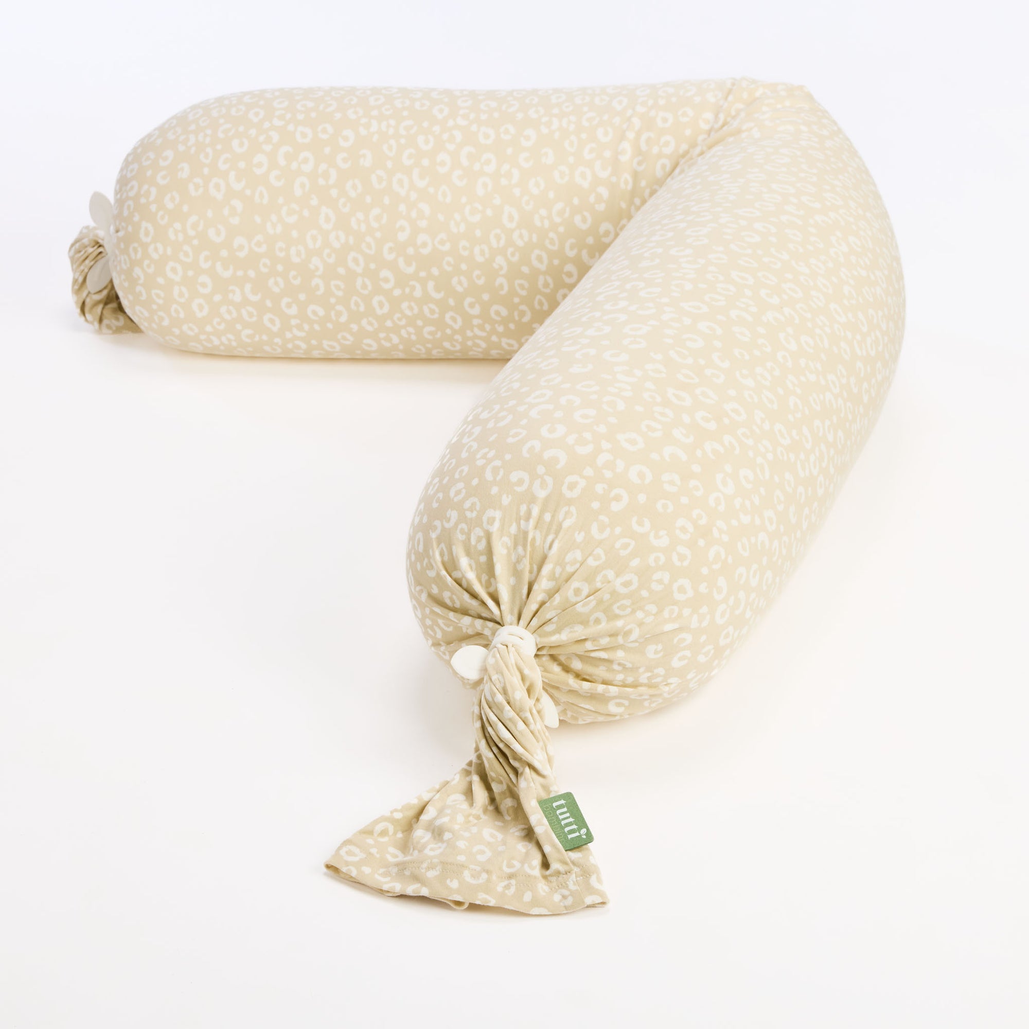 Pregnancy support pillow in Love Cats print with soft bead filling and flexible design, shown curved for full-body comfort and adaptable support.