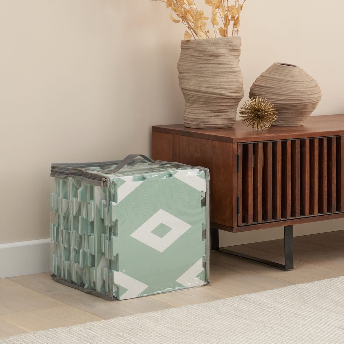 Diamond Mint puzzle playmat tiles neatly packed in a clear zip bag, showing the geometric pattern for easy storage and transport
