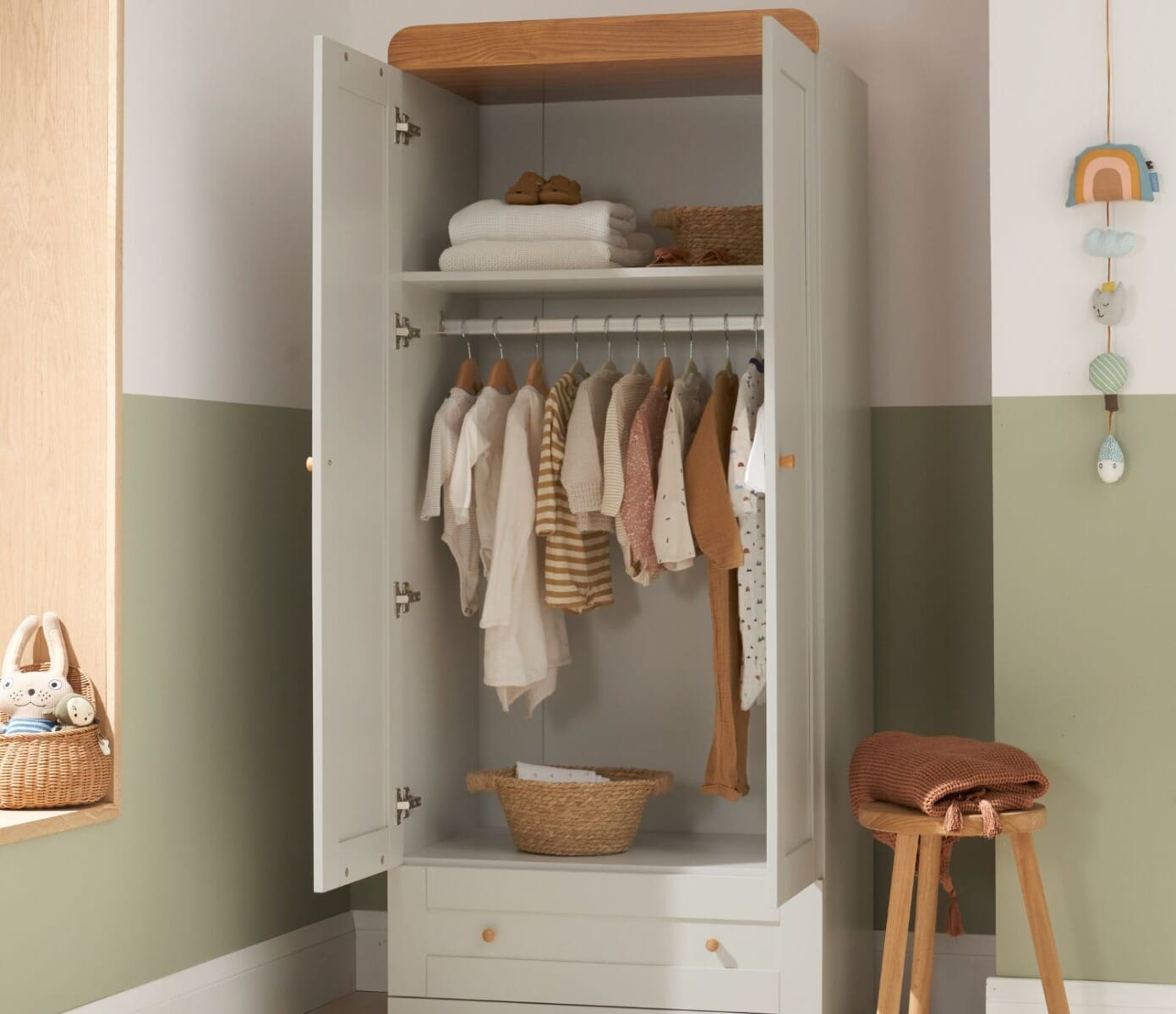 rio wardrobe in honey oak and dove grey showing spacious storage and clothes hanging neatly