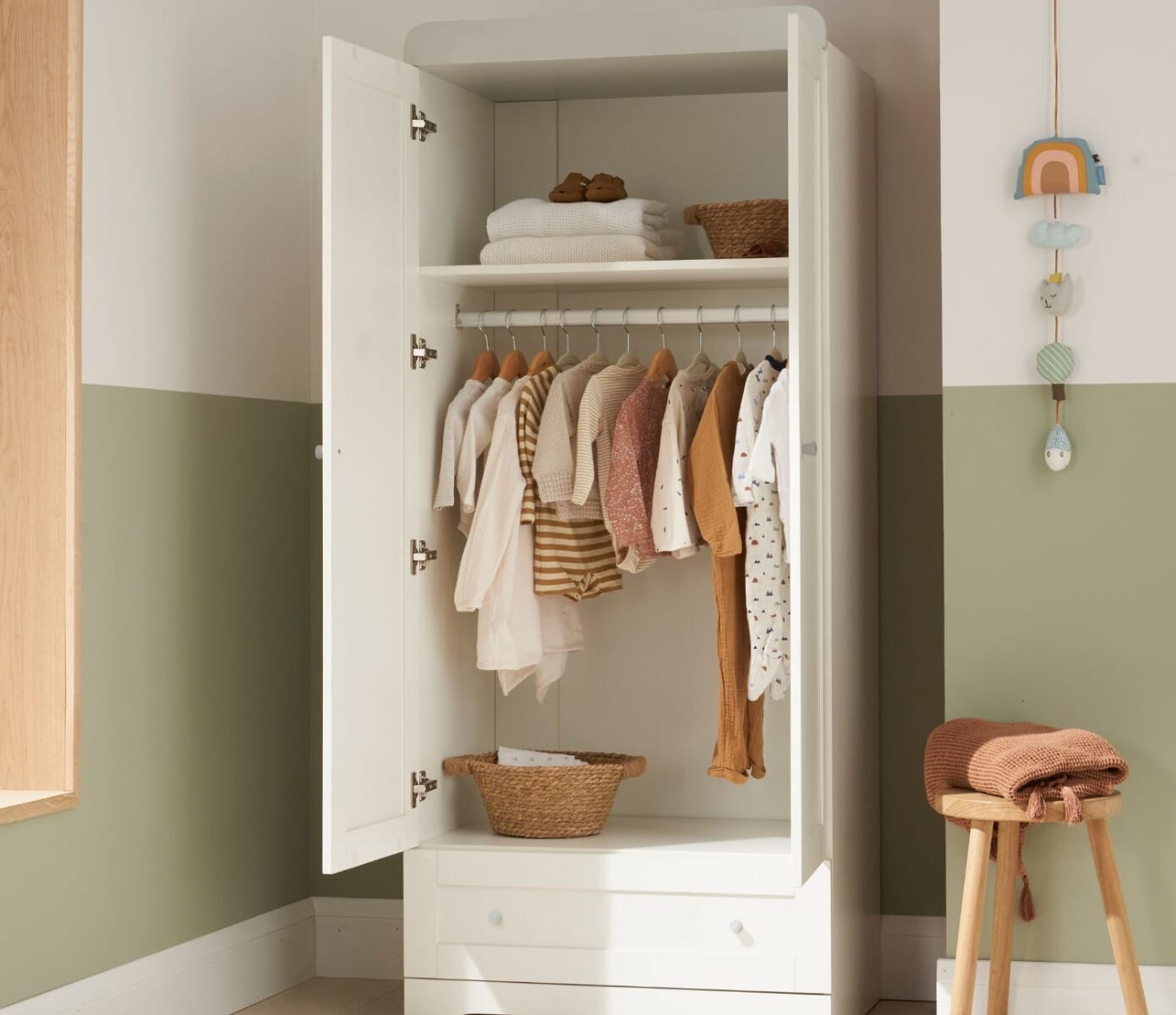 rio wardrobe with both doors open. Showing neatly organised towels and clothes.