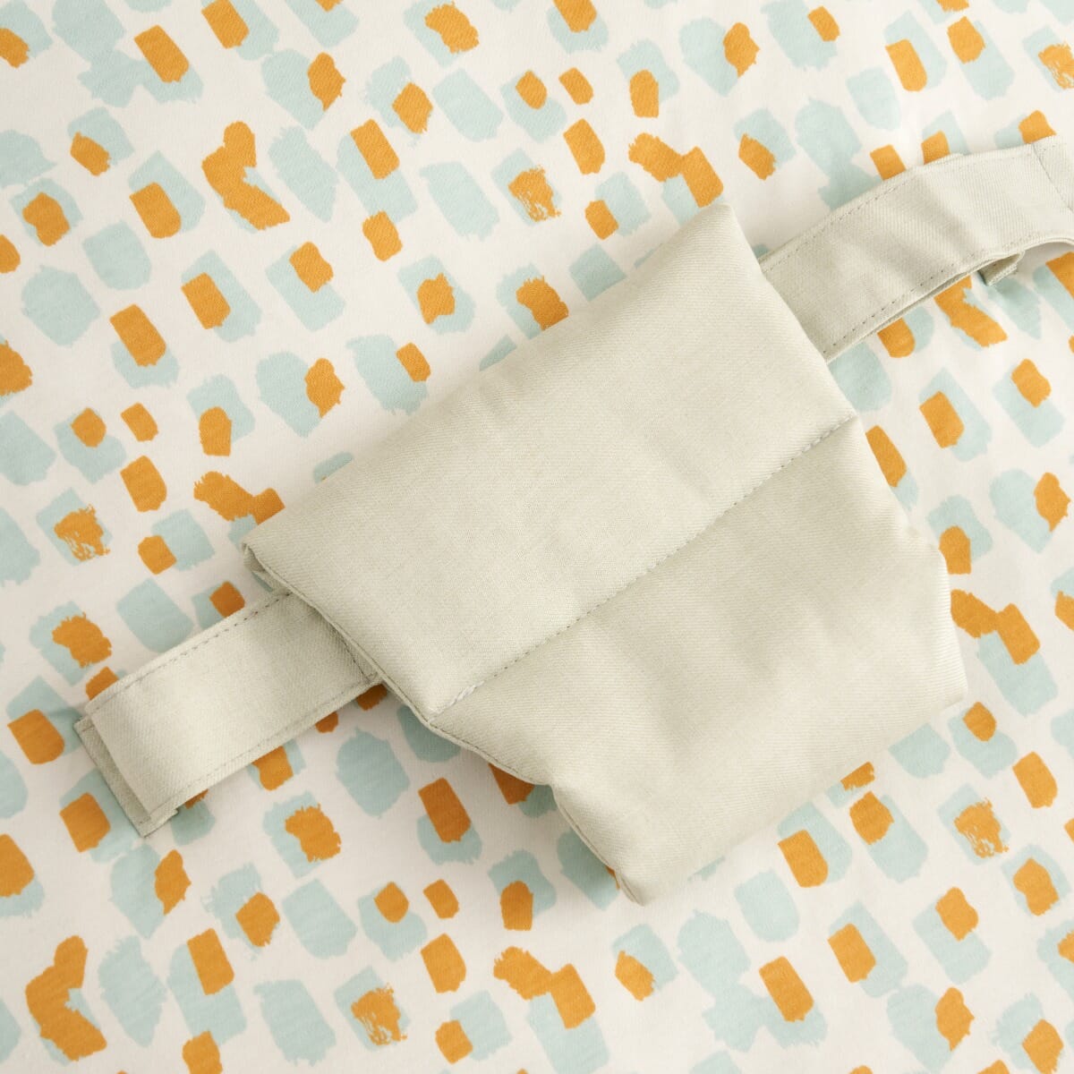 Detailed view of the Run Wild baby beanbag padded safety strap, highlighting soft fabric construction and adjustable fit