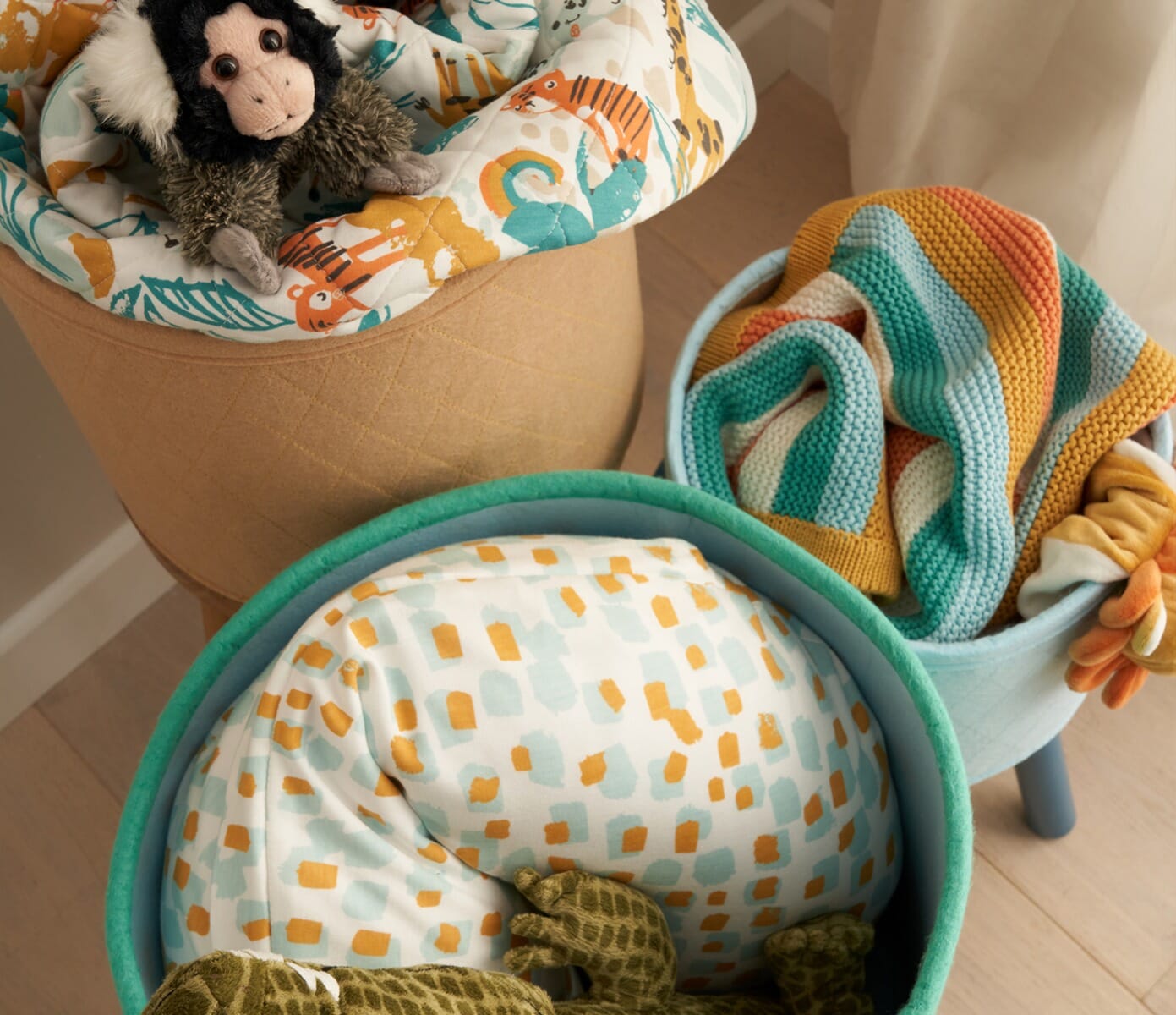 Run Wild storage baskets styled in a nursery setting, filled with toys and blankets to show practical everyday storage