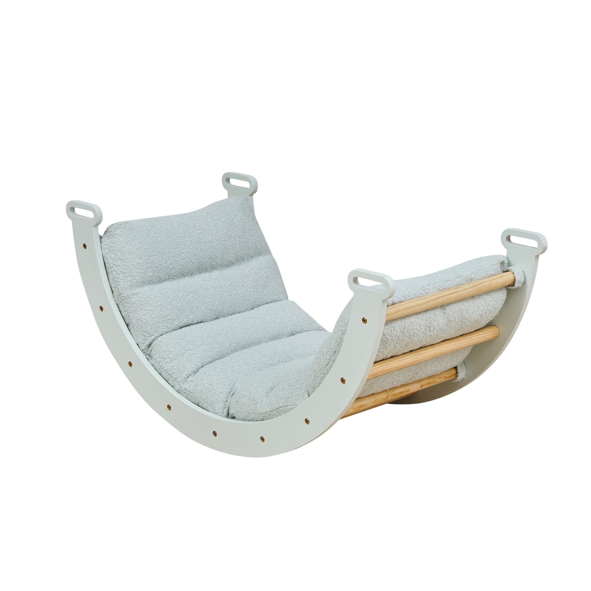 Softly padded Scala Montessori Pikler cushion in boucle sea mist shown in angled cutout view, highlighting its contoured comfort and secure fit