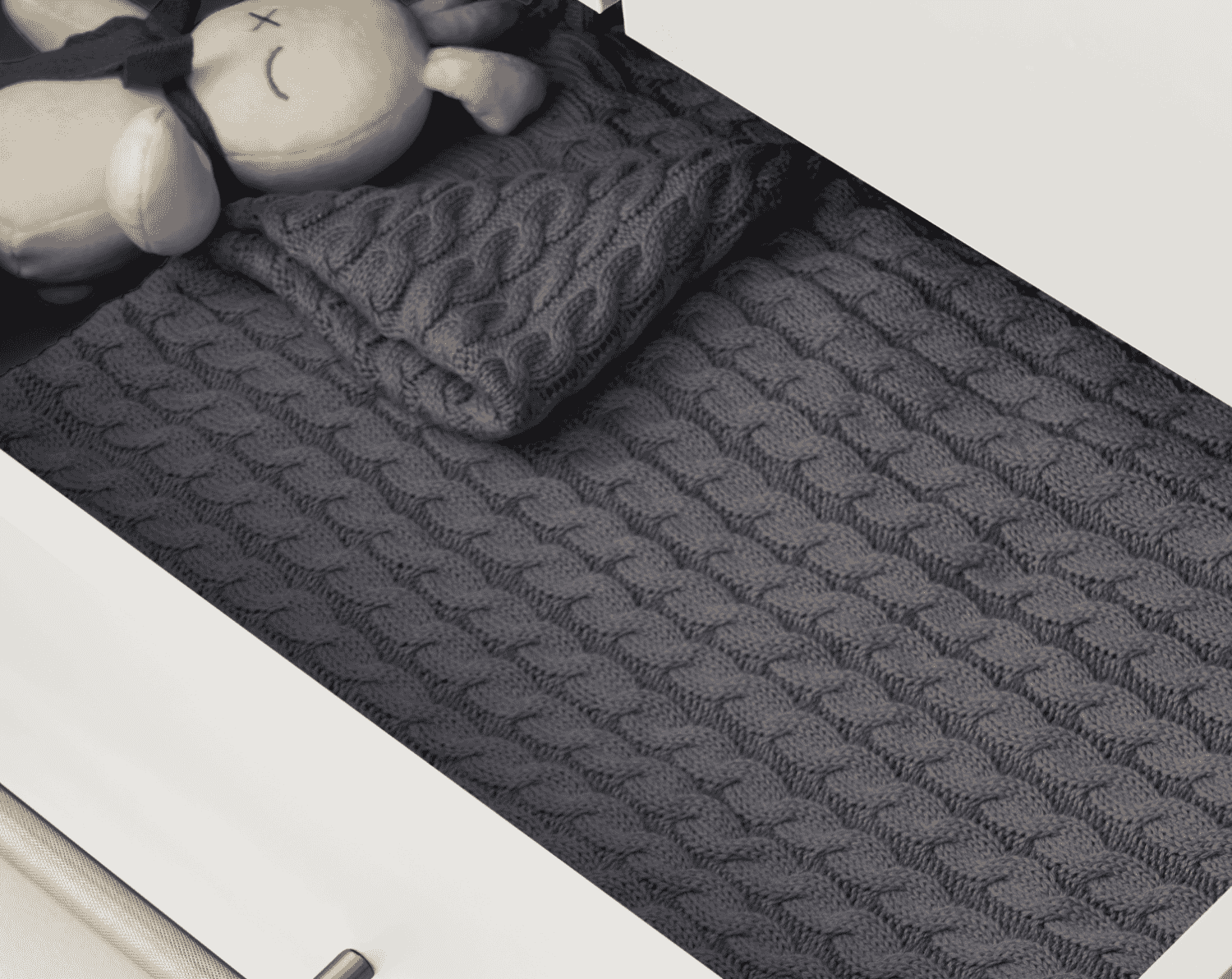 Close-up view of the Tivoli chest changer in white with an open drawer, showing smooth runners, deep storage space and soft folded textiles