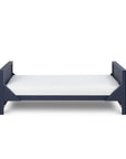 Tivoli cot bed in navy set as a toddler bed, designed for smooth transition with low height and secure frame