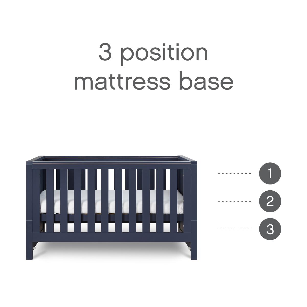 Cutout view of the Tivoli cot bed in navy, highlighting the three adjustable mattress base heights for comfort and safety as baby grows