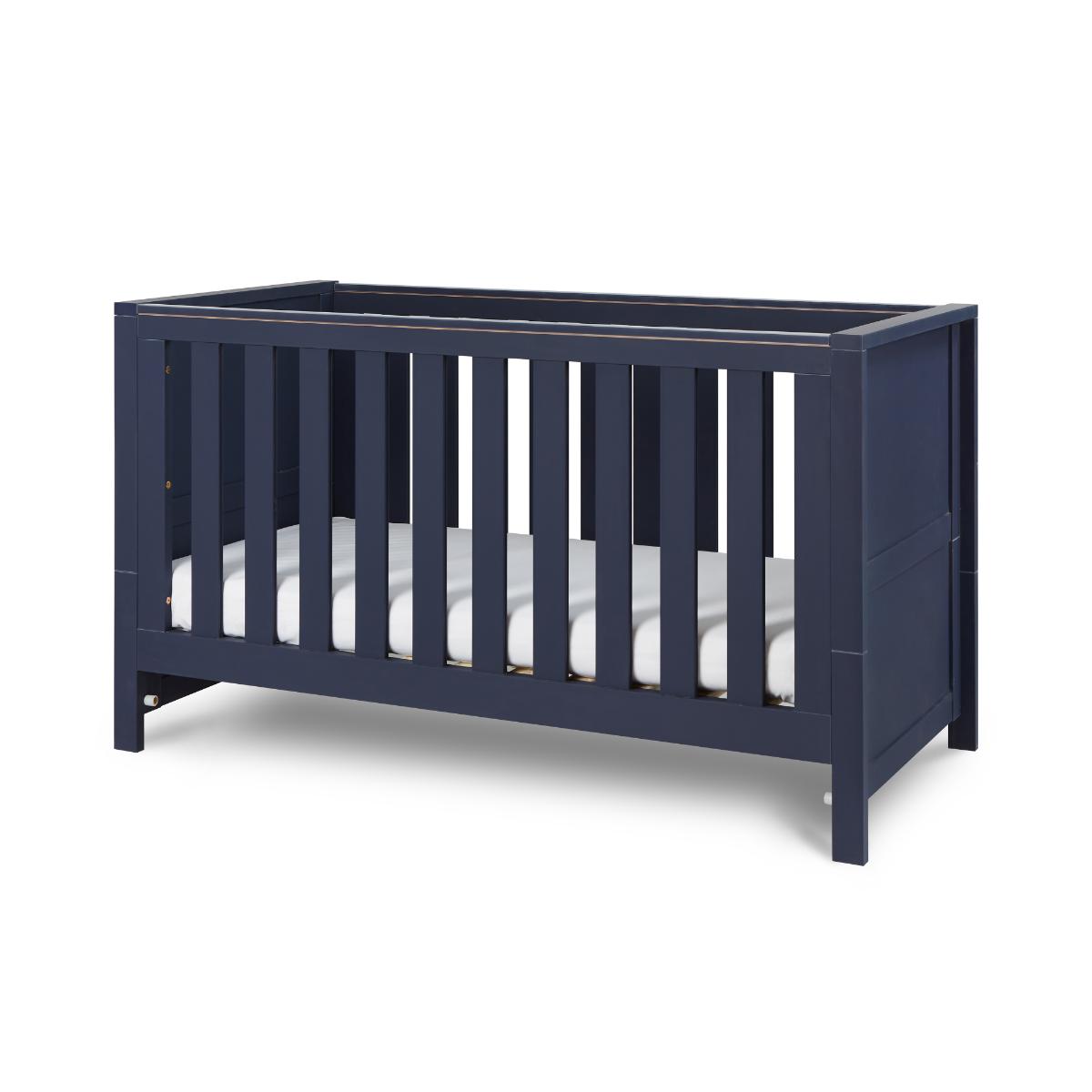 Angled view of the Tivoli cot bed in navy, featuring classic slatted sides, sturdy frame, and timeless nursery styling