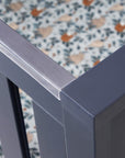 Close-up of the Tivoli cot bed’s navy teething rail, showing its smooth protective cover designed to support little ones safely