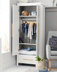 Lifestyle view of the Tivoli wardrobe in white with doors open, showing internal shelving, hanging rail and soft integrated lighting