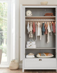 Verona wardrobe in white and oak with doors open – includes hanging rail, shelves, and lower drawer for flexible nursery storage