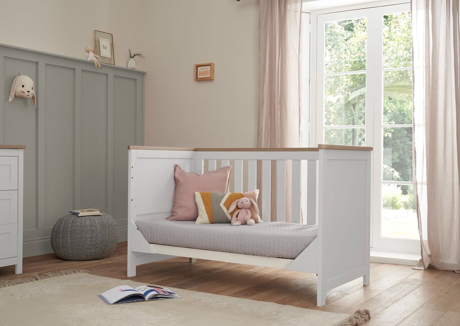 Cot bed in a sofa mode
