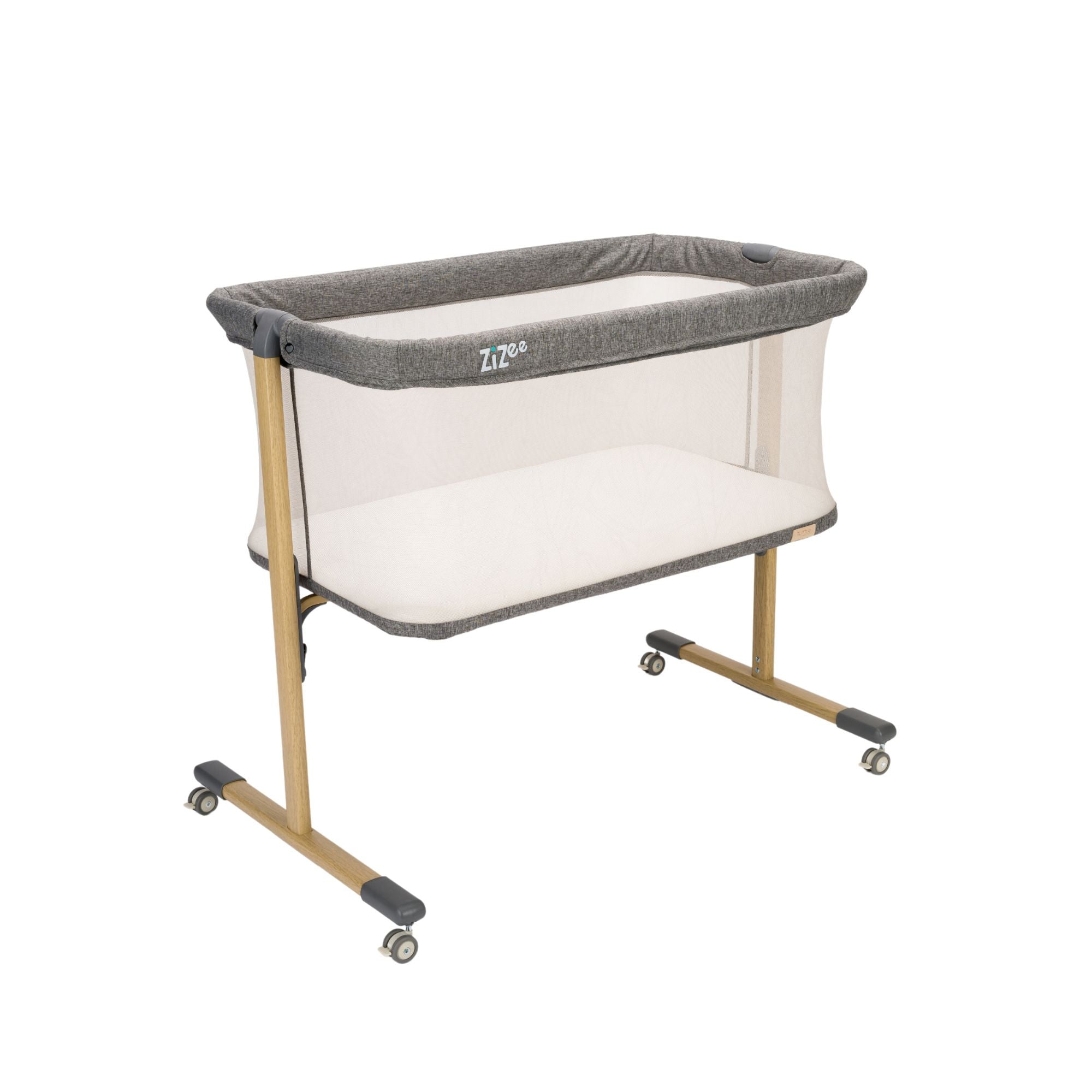 ZiZee portable baby crib with wheels on a white background