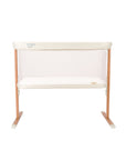 White crib with wooden frame on a white background